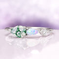 Green Moss Agate & Natural Australian Fire Opal Ring in Sterling Silver by Aquamarise featuring pear-shaped green moss agate, natural Australian white fire opal, and CZ accent on delicate band.