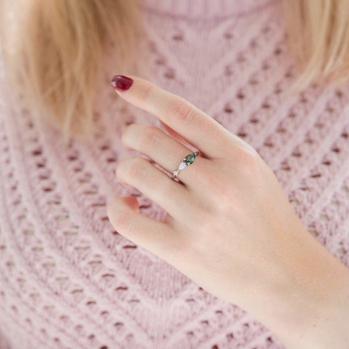 Green Moss Agate & Natural Australian Fire Opal Ring in Sterling Silver by Aquamarise worn on hand, featuring pear-shaped green moss agate and white fire opal with delicate sterling silver band.
