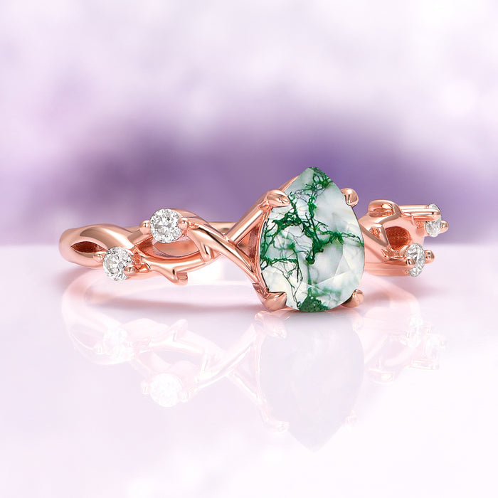 Green Moss Agate Twig Ring in 14K Rose Gold Vermeil by Aquamarise with a pear-shaped green moss agate and delicate twig-inspired band accented with small sparkling stones.