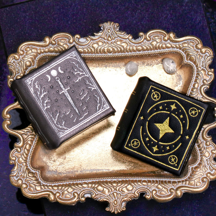 Thornwood Bronze and Night Court handmade leather book ring boxes by Aquamarise, shown side by side
