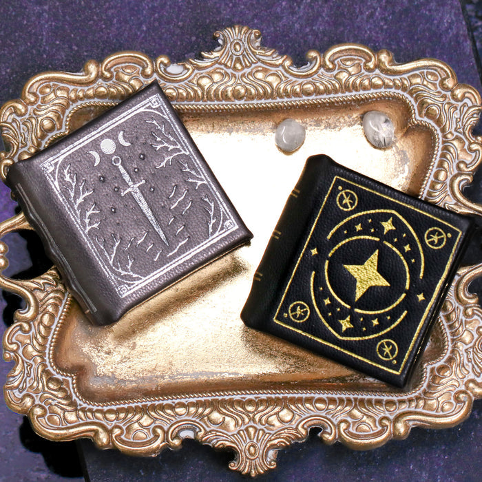 Night Court and Thornwood Bronze leather book ring boxes by Aquamarise with embossed cover artwork