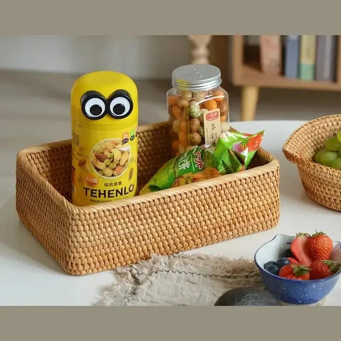 Handwoven rattan storage basket with snacks and candies, adding warmth and organization to any space.