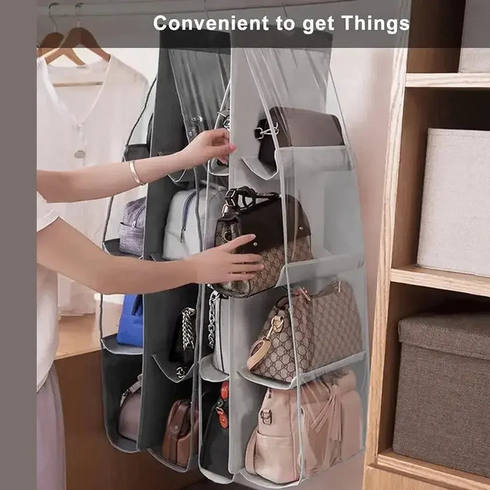 Hanging handbag organizer with six pockets for easy access, showcasing several bags in a closet setting.