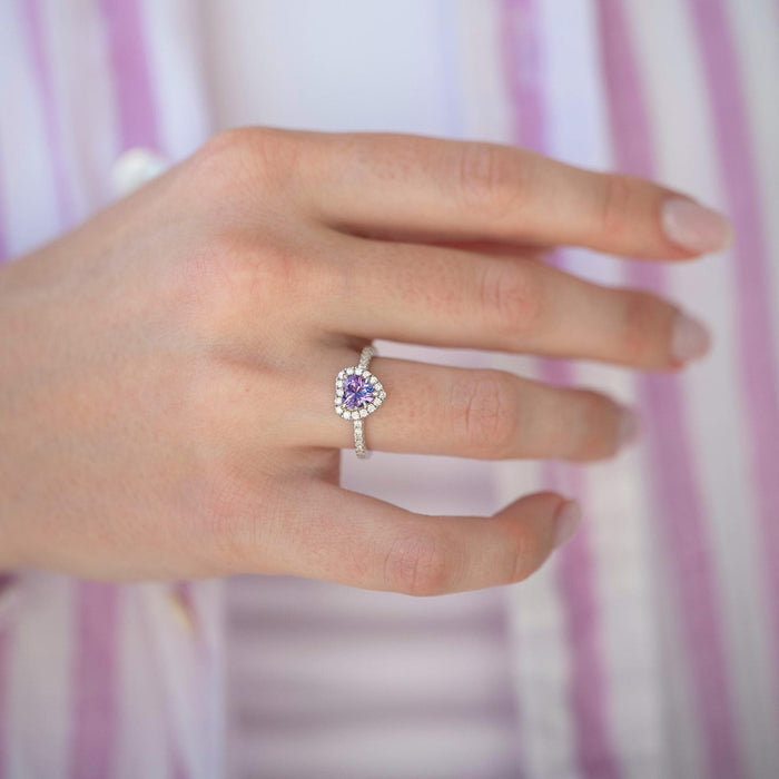 Heart-cut alexandrite promise ring in sterling silver by Aquamarise, showing the color-changing center stone