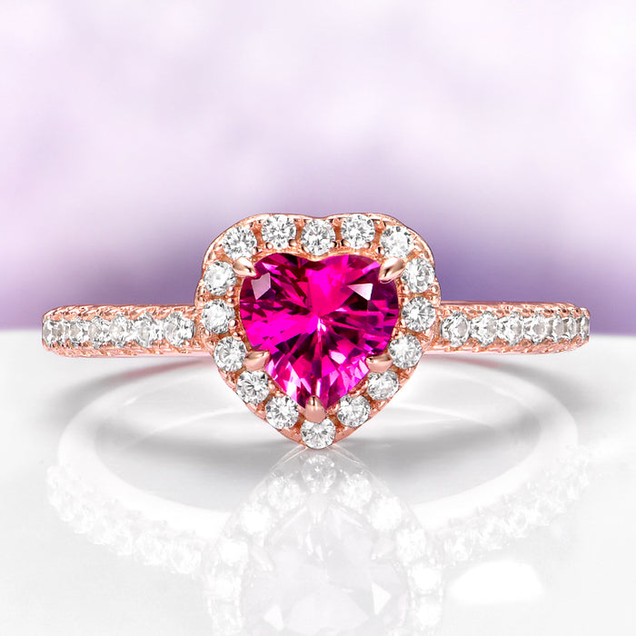 Heart Cut Ruby Promise Ring in 14K Rose Gold Vermeil by Aquamarise, featuring a heart-shaped ruby centerpiece surrounded by sparkling diamond accents on a rose gold vermeil band.