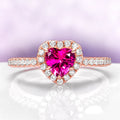 Heart Cut Ruby Promise Ring in 14K Rose Gold Vermeil by Aquamarise, featuring a heart-shaped ruby centerpiece surrounded by sparkling diamond accents on a rose gold vermeil band.