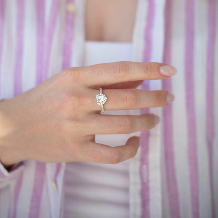 Heart White Sapphire Promise Ring in Sterling Silver by Aquamarise, featuring a heart-shaped white sapphire framed by pavé accents on a polished sterling silver band, styled on a hand.