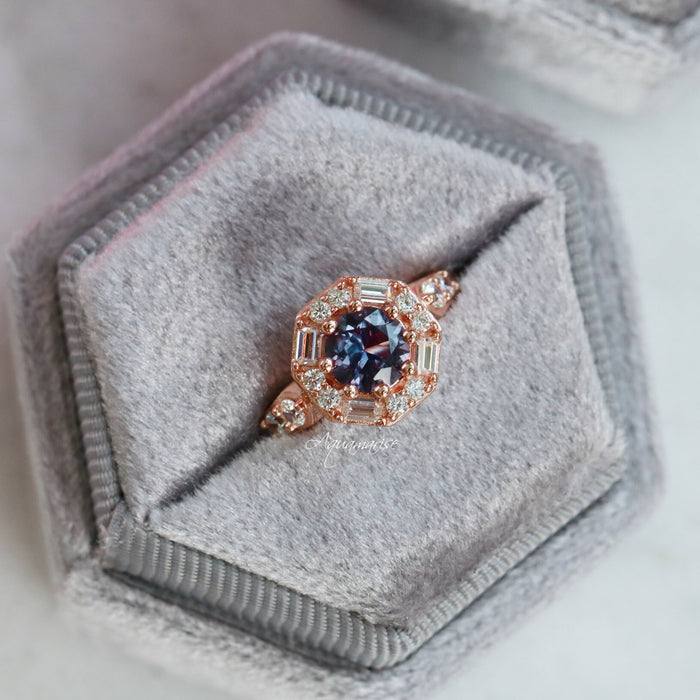 Hexagon Alexandrite Halo Ring in 14K Rose Gold Vermeil by Aquamarise featuring a round lab-created alexandrite surrounded by baguette and round diamonds in a rose gold vermeil setting.