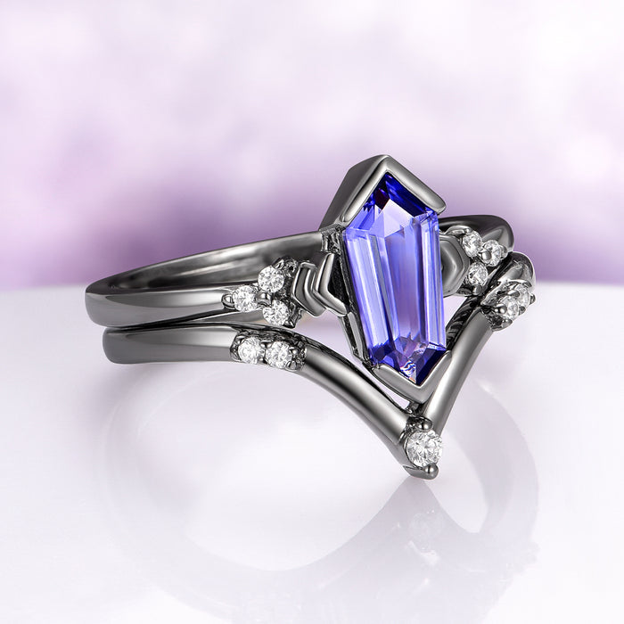 Orion Nebula™ & Tanzanite Couples Ring Set featuring an elongated tanzanite with diamond accents in a sleek black finish, designed by Aquamarise for Matching Couples' Rings collections.