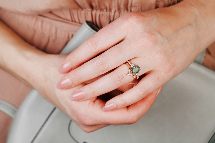 Hexagon Cut Green Moss Agate Engagement Ring Set in 14K Solid Rose Gold by Aquamarise Gold, featuring a unique hexagon green moss agate stone on a hand with natural nails.