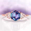 Hexagon Cut Lab-Grown Alexandrite Ring in 14K Rose Gold Vermeil by Aquamarise, showcasing a vibrant hexagonal alexandrite center stone accented with baguette and round white gemstones on a polished rose gold vermeil band, from Rose Gold Vermeil Rings, June Birthstone Jewelry, and Engagement Rings for Women collections.