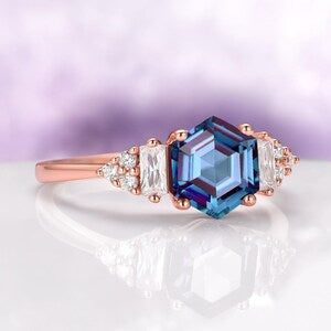 Hexagon Cut Lab-Grown Alexandrite Ring in 14K Rose Gold Vermeil by Aquamarise, featuring a vibrant hexagon-shaped lab-grown alexandrite center stone with sparkling side stones on a polished rose gold vermeil band, part of Rose Gold Vermeil Rings and June Birthstone Jewelry collections.