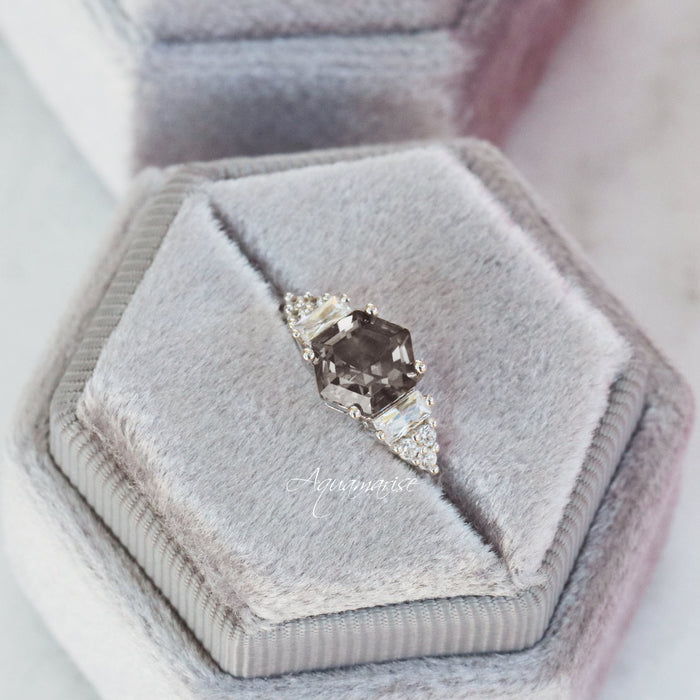 Hexagon Simulated Gray Diamond Ring in Sterling Silver by Aquamarise featuring a modern geometric design with baguette and round accents, displayed in a soft gray velvet ring box.