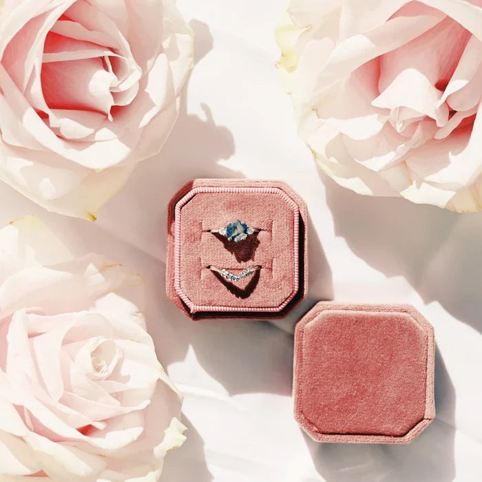 Hexagon Moss Agate Fairy Ring Set in Sterling Silver displayed in a pink velvet box surrounded by soft pink roses, showcasing Aquamarise’s nature-inspired and unique design.