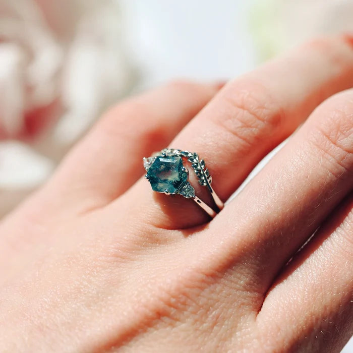 Hexagon Moss Agate Fairy Ring Set in Sterling Silver on hand featuring a natural blue-green moss agate hexagon center and delicate leaf-inspired band by Aquamarise.