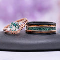 Hexagon Moss Agate & Whiskey Barrel Couples Rings Set featuring a rose gold hexagon moss agate ring with leaf details and a black tungsten band with green moss agate and wood inlay by Aquamarise.