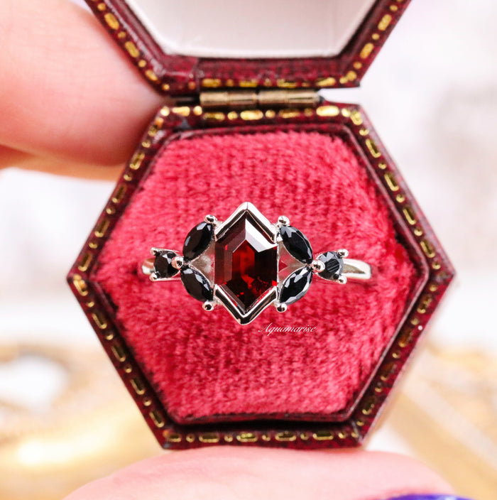 Hexagon Natural Red Garnet & Black Onyx Engagement Ring in 14K White Gold by Aquamarise Gold, featuring a hexagon-cut red garnet with black onyx accents in a vintage red velvet ring box.
