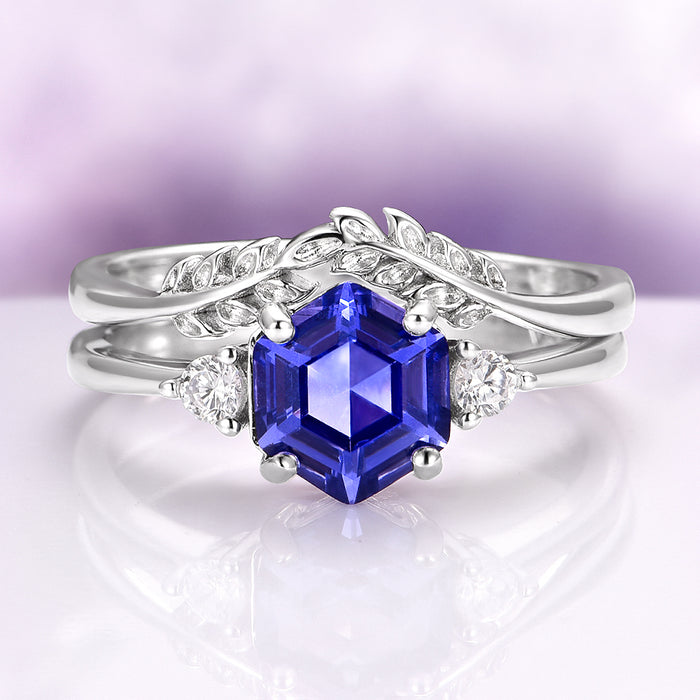 Hexagon Tanzanite Leaf Ring Set in Sterling Silver featuring a hexagon-cut tanzanite with leaf-inspired bands and diamond accents by Aquamarise, a nature-inspired engagement ring design.