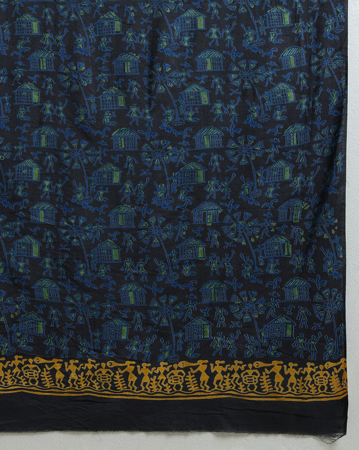 Unstitched Katan silk suit set with deep indigo panels block printed in folk figure silhouettes and geometric shapes, a plain olive green piece, and mustard yellow figurative border bands at the edges and dupatta ends.