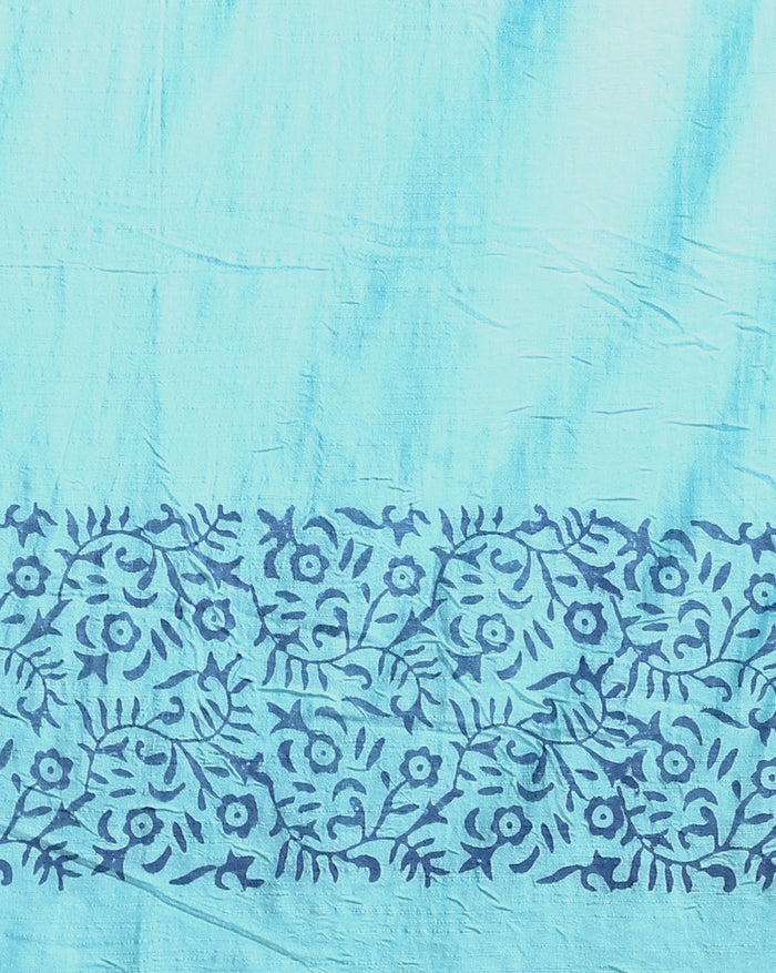Indigo Katan silk unstitched suit set with all-over small paisley block print, pale blue decorative bands with yellow and green accents, and a fringed dupatta