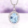 Iris Halo Oval Aquamarine Necklace in Sterling Silver featuring a 2.3 ct simulated aquamarine surrounded by a halo of sparkling simulated diamonds by Aquamarise.