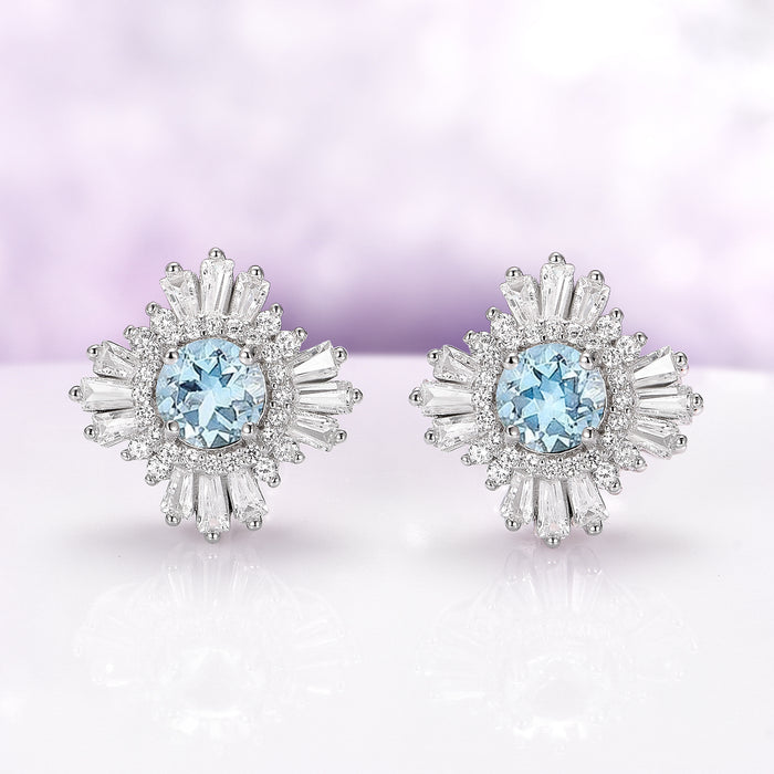 Joelle Art Deco Aquamarine Earrings in Sterling Silver by Aquamarise, featuring vintage-inspired round aquamarine centers surrounded by sparkling baguette and round accents.