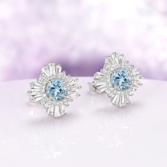 Joelle Art Deco Aquamarine Earrings in Sterling Silver featuring round aquamarine centers surrounded by baguette and round accents, from Aquamarise’s March Birthstone Jewelry collection.