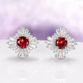 Joelle Natural Red Garnet Stud Earrings in Sterling Silver by Aquamarise, featuring vintage Art Deco design with vibrant red garnet centers surrounded by baguette and round accents.
