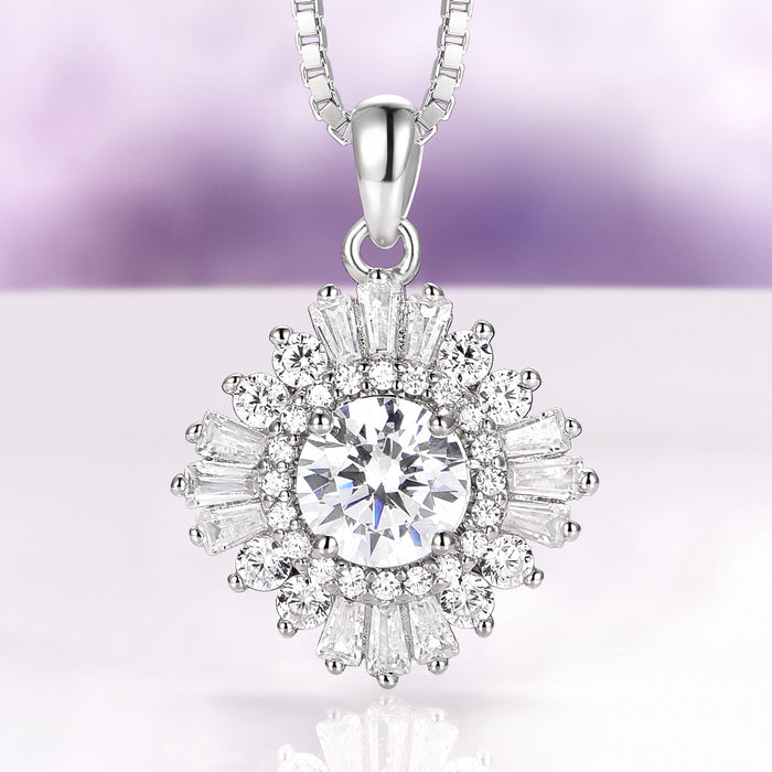 Joelle Simulated Diamond Starburst Pendant Necklace in Sterling Silver by Aquamarise, featuring a sparkling center stone with baguette and round simulated diamond accents in a starburst design.