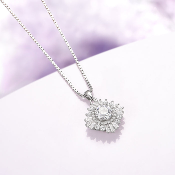 Joelle Simulated Diamond Starburst Pendant Necklace in Sterling Silver by Aquamarise, featuring a sparkling starburst design with radiant simulated diamonds on an elegant sterling silver chain.