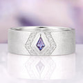 Elowen Alexandrite Couples Ring Set featuring a sterling silver band with a central violet-hued lab-grown alexandrite surrounded by sparkling accent diamonds by Aquamarise.