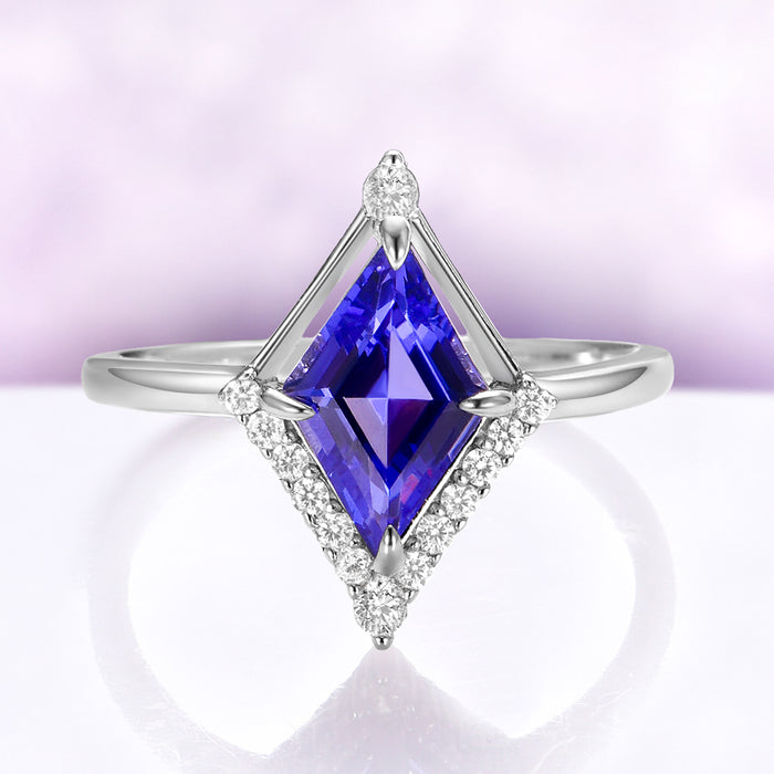 Kite Cut Geometric Tanzanite Ring Set in Sterling Silver by Aquamarise, featuring a rhombus-cut deep blue simulated tanzanite surrounded by sparkling CZ accents on a polished band.