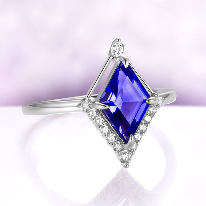 Kite Cut Geometric Tanzanite Ring Set in Sterling Silver by Aquamarise, featuring a deep blue rhombus-cut simulated tanzanite with sparkling CZ accents on a polished silver band.