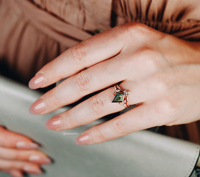 Kite Green Moss Agate Bezel Engagement Ring Set in 14K Solid Rose Gold by Aquamarise Gold, featuring a kite-shaped green moss agate with delicate rose gold and diamond detailing on a woman’s hand.