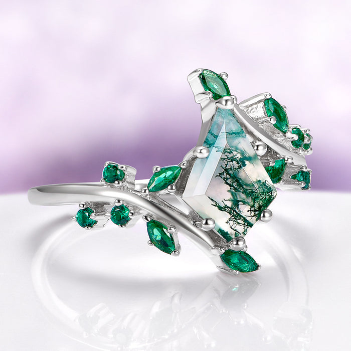 Kite Moss Agate & Emerald Leaf Couples Ring Set showcasing a kite-shaped moss agate and marquise-cut emeralds on a delicate silver band by Aquamarise, inspired by nature's elegance.