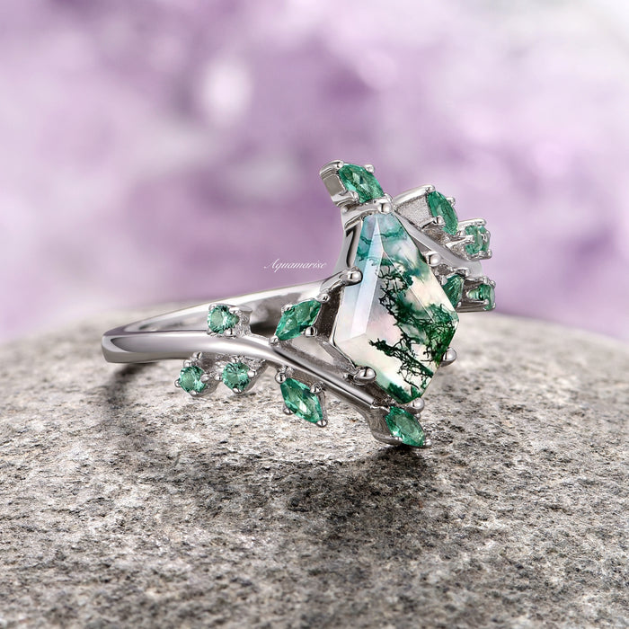 Kite Moss Agate & Emerald Leaf Couples Ring Set featuring a kite-shaped moss agate stone with natural green inclusions, accented by marquise and round emerald leaves on a polished silver band, crafted by Aquamarise.