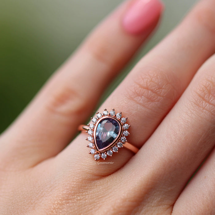 Lab Alexandrite Halo Ring in 14K Rose Gold Vermeil featuring a pear-shaped lab alexandrite surrounded by sparkling cubic zirconia, styled by Aquamarise in a romantic rose gold vermeil setting.