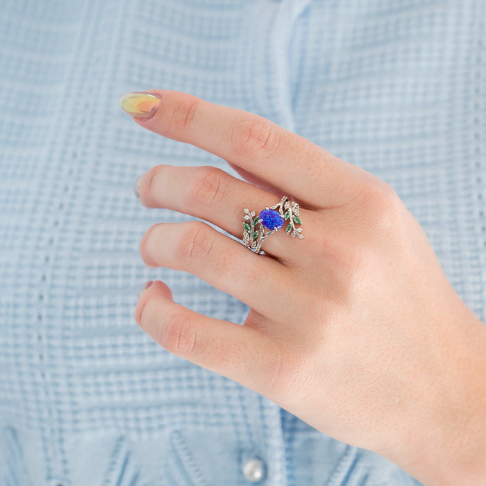 Lavender Fire Opal & Emerald Leaf Couples Ring Set featuring a delicate silver band with a vibrant purple fire opal and detailed green emerald leaf accents, showcasing Aquamarise craftsmanship in nature-inspired matching rings.