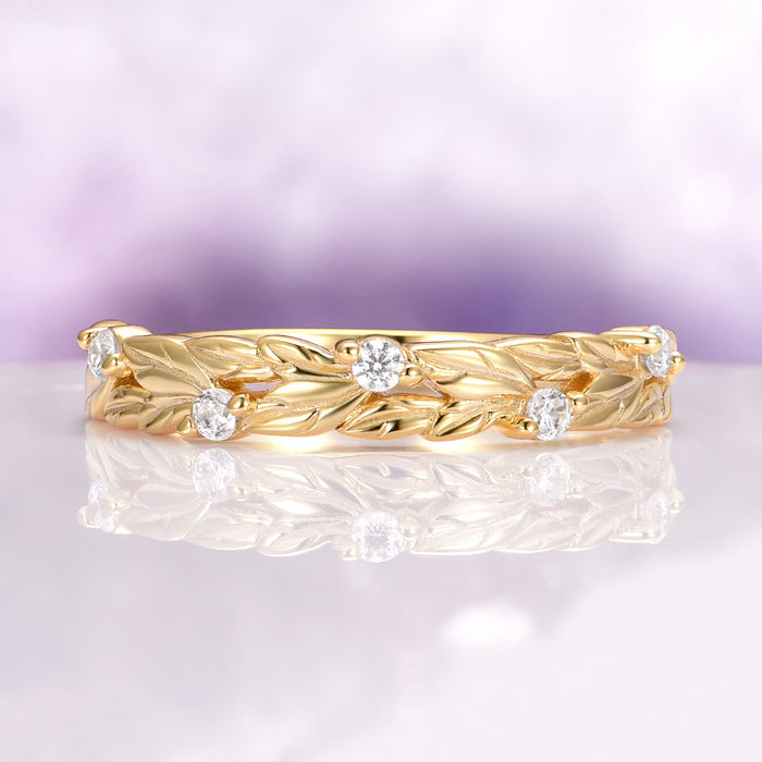 Diamond Leaf Wedding Band in Solid 14K Yellow Gold by Aquamarise Gold, featuring delicate leaf motifs accented with sparkling diamonds on a finely crafted yellow gold band, part of elegant women’s wedding bands and nature-inspired collections.