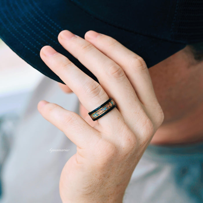 Light Blue Fire Opal & Opalescent Sapphire Couples Ring Set worn on hand, featuring crushed opal and sapphire inlay with a black finish, designed by Aquamarise for matching couples' rings.
