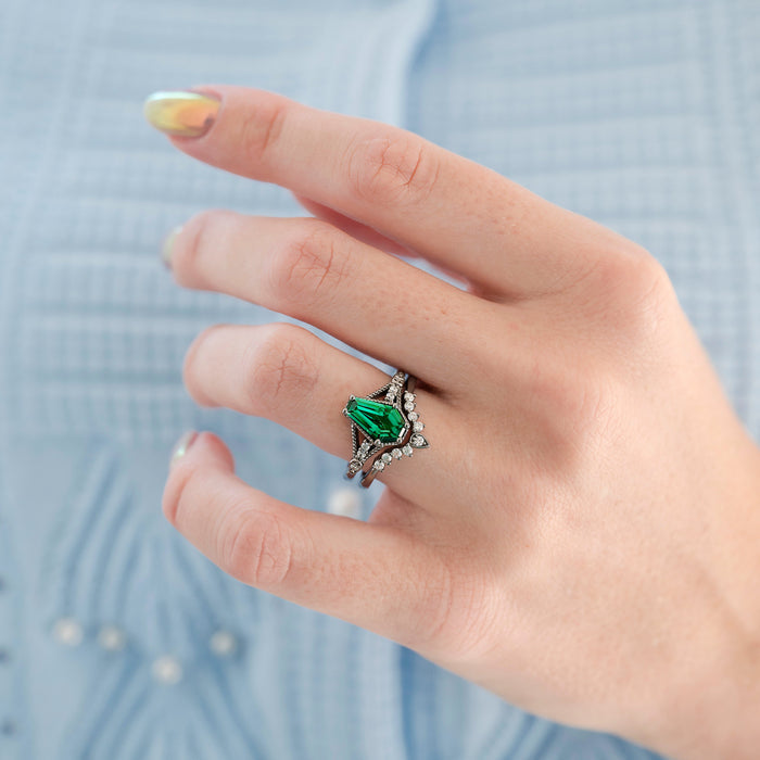 Lilith Coffin Cut Emerald & Green Fire Opal Couples Ring Set by Aquamarise features a striking coffin-cut emerald gemstone with green fire opal accents and black-finished silver, part of Matching Couples' Rings and October Birthstone collections.