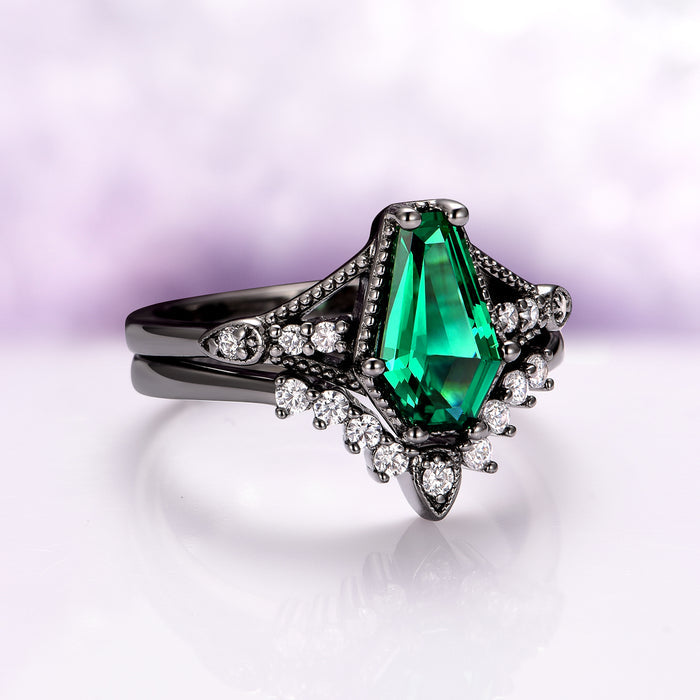 Lilith Coffin Cut Emerald & Green Fire Opal Couples Ring Set features a striking coffin-cut emerald centerpiece set in black-finished silver, accented with sparkling white stones, from Aquamarise’s Matching Couples' Rings and October Birthstone collections.