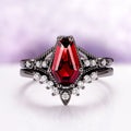 Lilith Coffin Cut Natural Red Garnet Couples Ring Set by Aquamarise featuring a bold coffin-shaped garnet with black finish and sparkling diamond accents, from matching couples' rings collection.