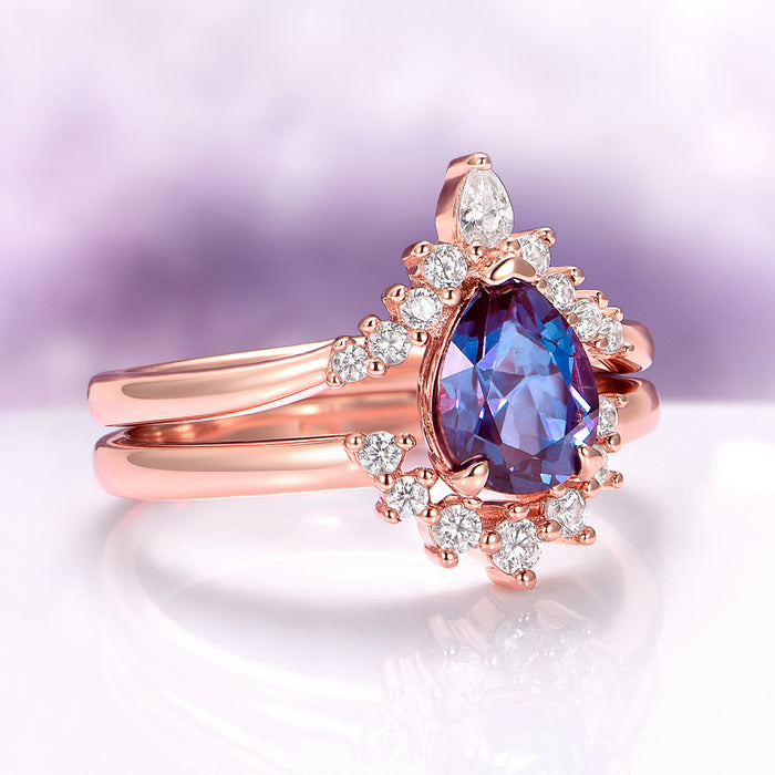 Lunette Teardrop Alexandrite Ring Set in 14K Rose Gold Vermeil by Aquamarise featuring a pear-shaped alexandrite surrounded by diamonds on a rose gold vermeil band.