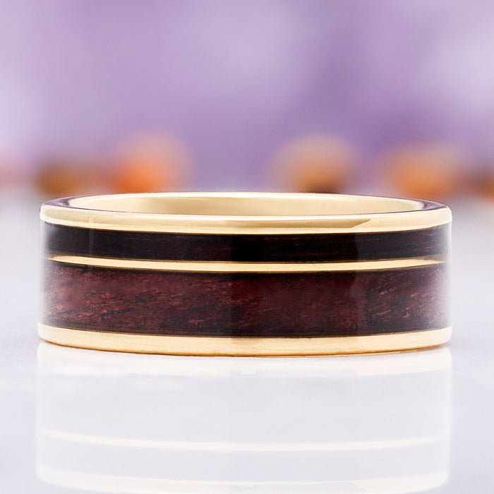 Front view of the 8mm M1 Garand and purpleheart wood wedding band in gold tungsten carbide with twin gold rails framing the wood inlay