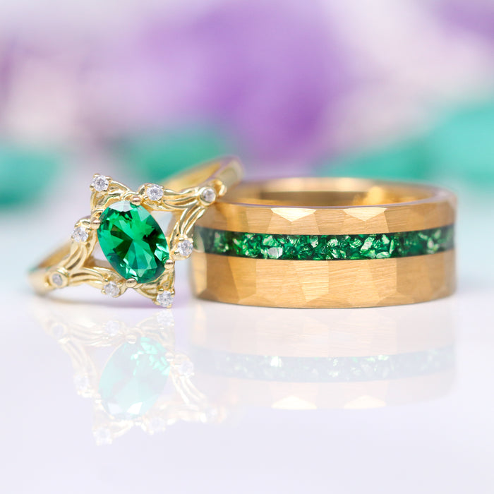 Maeve Emerald Couples Ring Set by Aquamarise, featuring nature-inspired gold wedding bands with a radiant emerald and matching green gemstone inlay, elegant and meaningful jewelry for couples.