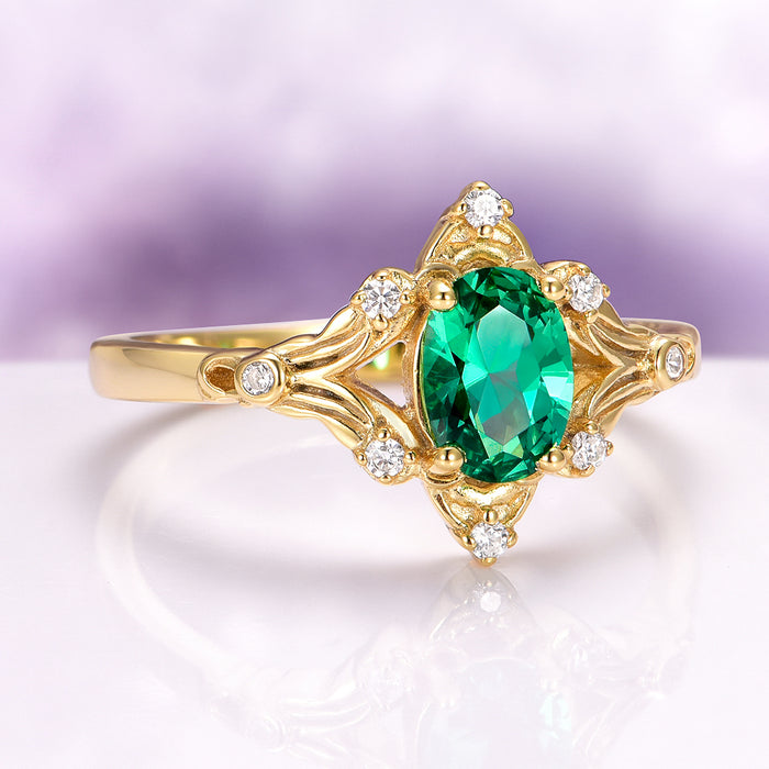 Maeve Emerald Couples Ring Set featuring a radiant emerald centerpiece with gold and diamond accents, designed by Aquamarise for matching couples' rings and meaningful jewelry gifts.