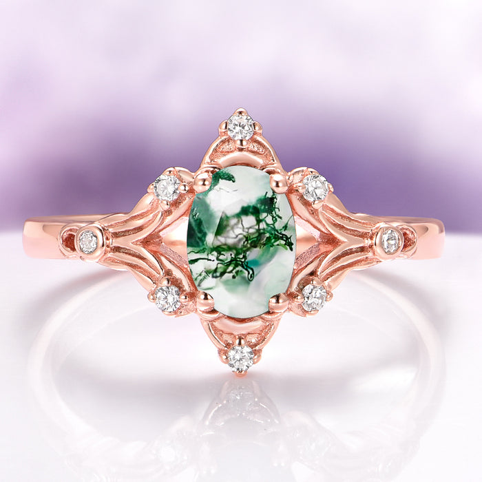 Maeve Green Moss Agate Ring- 14K Solid Rose Gold by Aquamarise Gold, featuring an oval green moss agate gemstone set in an ornate rose gold band accented with sparkling white stones, blending vintage charm with nature-inspired elegance.