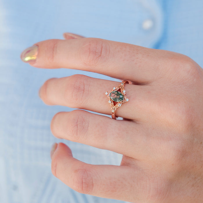 Maeve Green Moss Agate Ring- 14K Solid Rose Gold featuring a marquise-cut green moss agate gemstone set in an elegant rose gold band with delicate white stone accents, by Aquamarise Gold.
