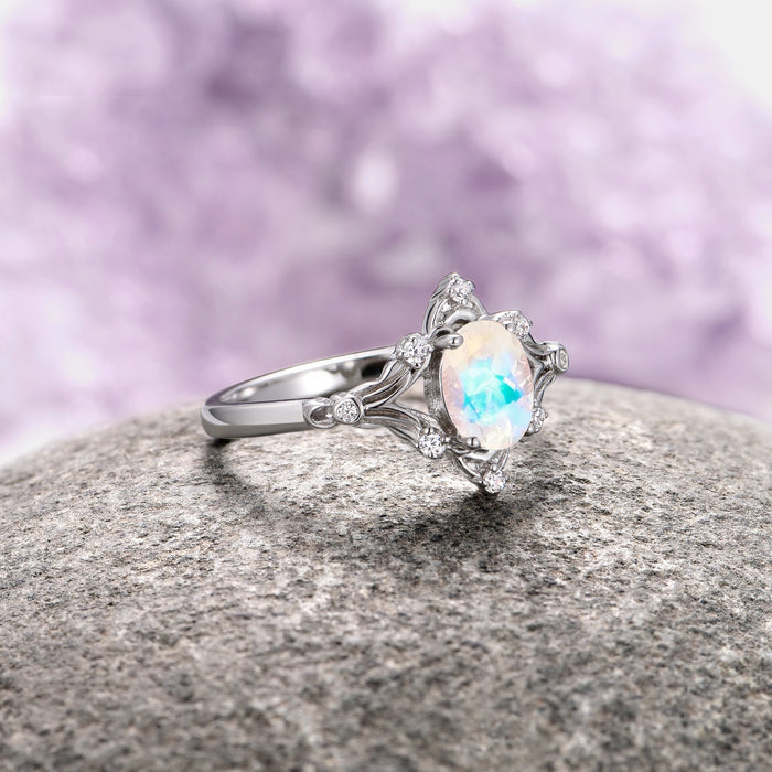 Maeve Vintage Moonstone Engagement Ring in 14K White Gold by Aquamarise Gold showcasing a luminous oval moonstone set in an intricately detailed band, part of Solid Gold Engagement Rings, June Birthstone Jewelry, and Nature-Inspired Engagement Rings collections.